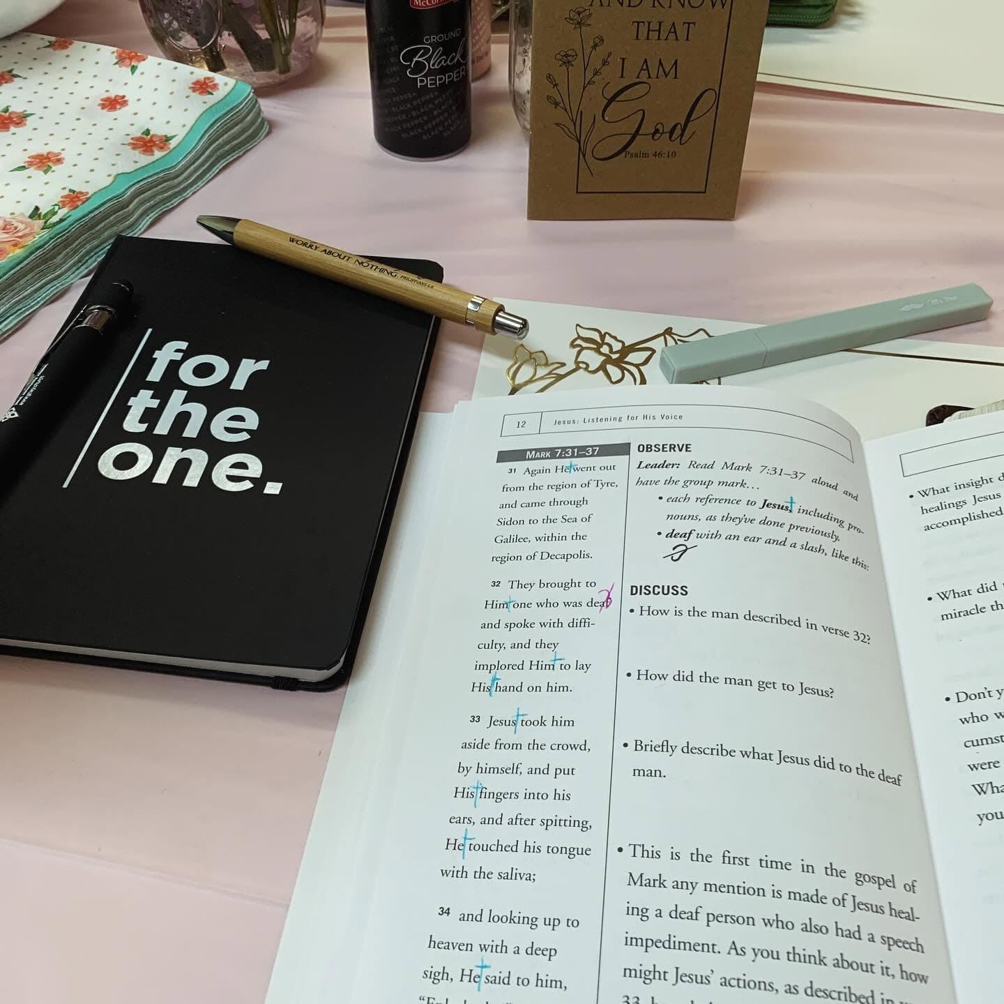 Open Bible study materials and notebook on a table